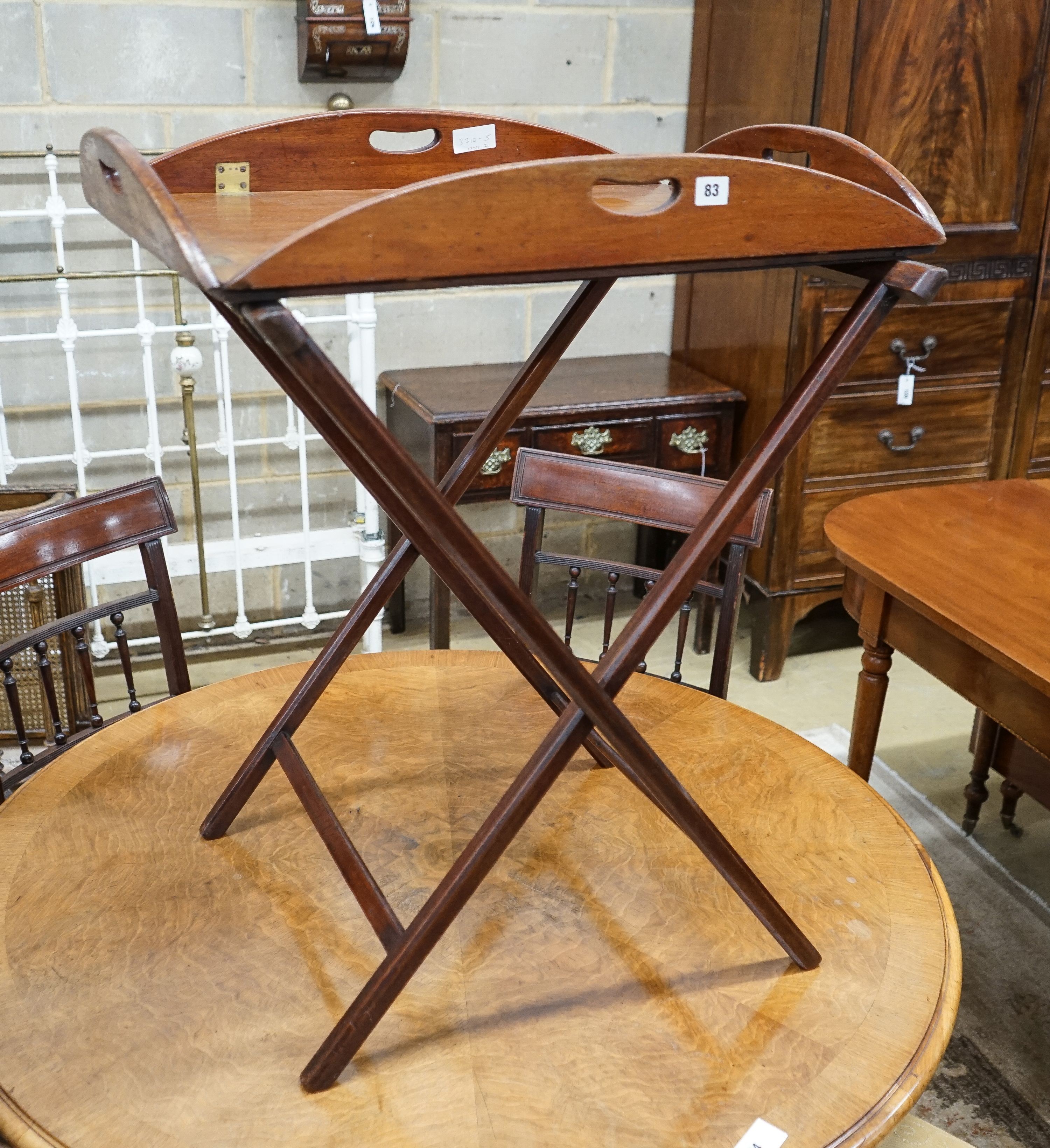 A Victorian brass mounted mahogany folding butler's tray on stand, width 69cm, depth 49cm, height 86cm